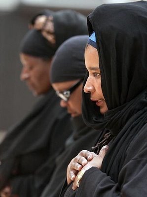 Ann Holmes Redding praying in the masjid